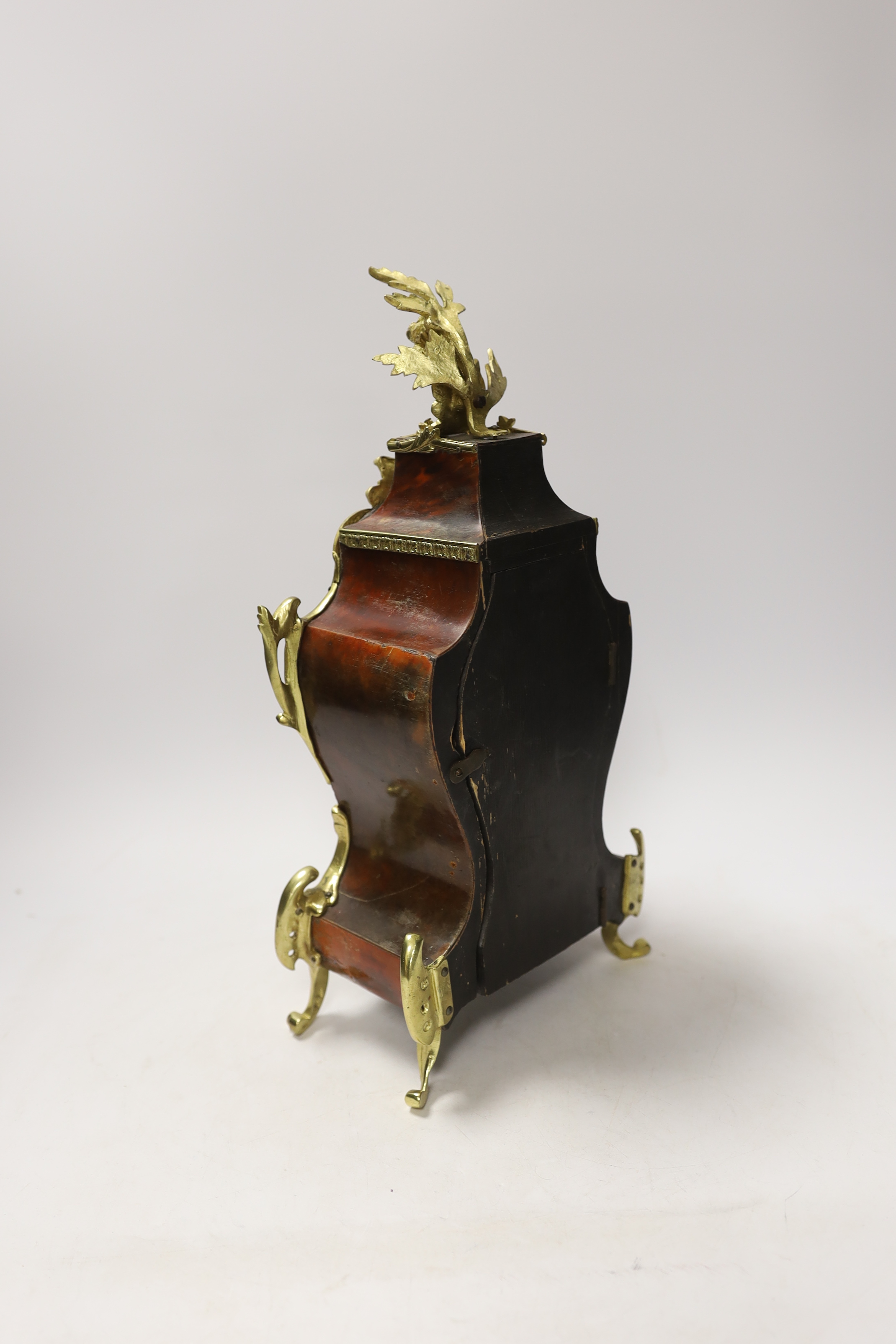 A Louis XV style tortoiseshell and ormolu mounted mantel clock with enamel Roman numeral dial, 35cm high